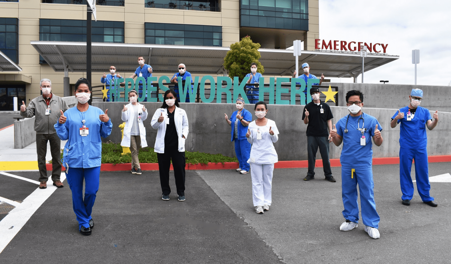 Providers in front of the hospital