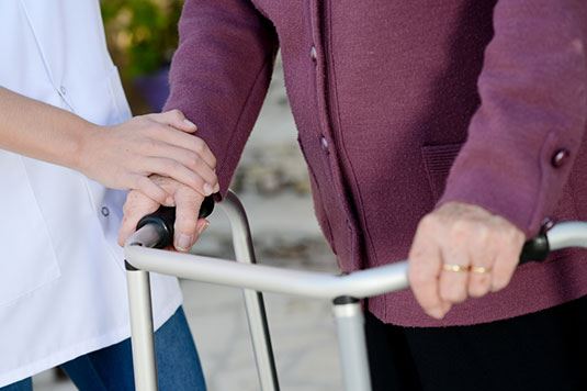 A person walking with a walker