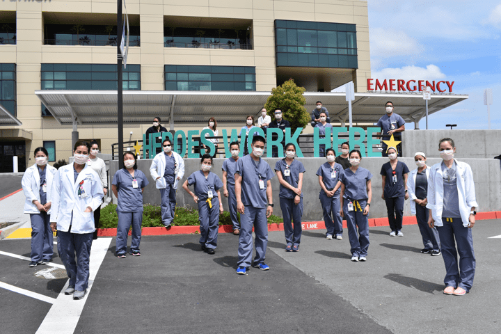 Providers standing outside the hospital 